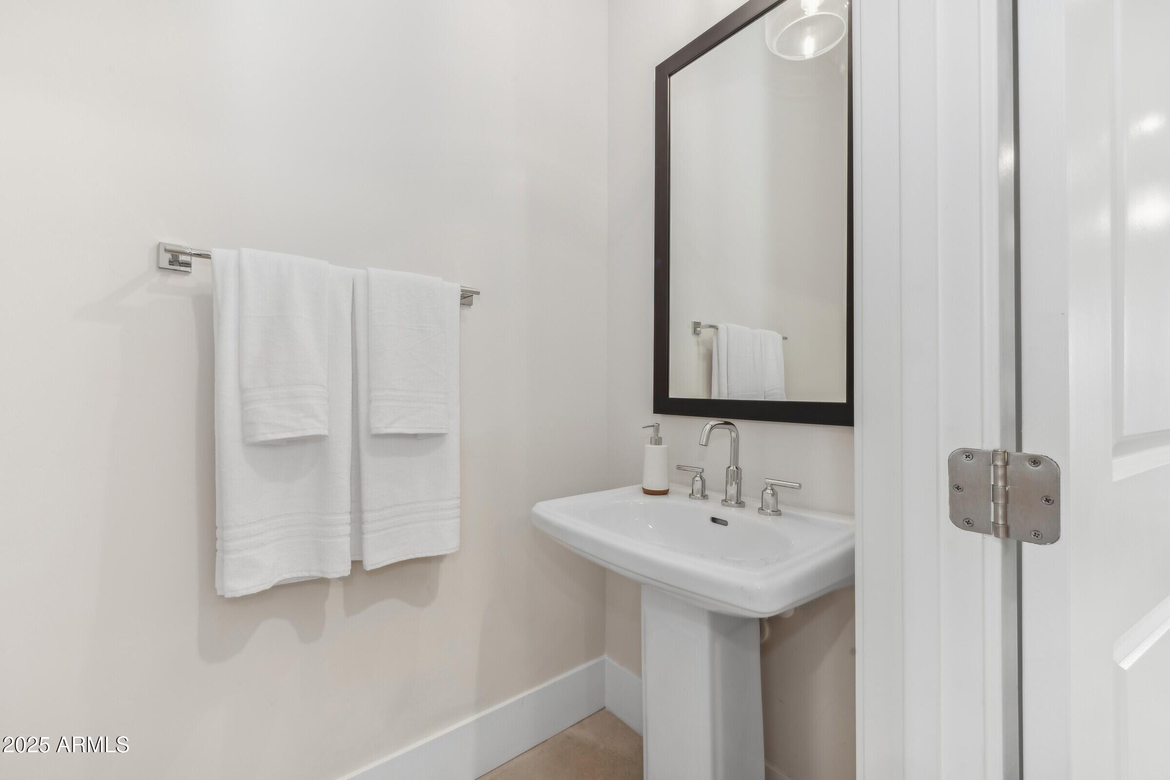 621 East Grayling Road San Tan Valley, AZ 85140 - Photo 14 of 33 a bathroom with a sink and a mirror
