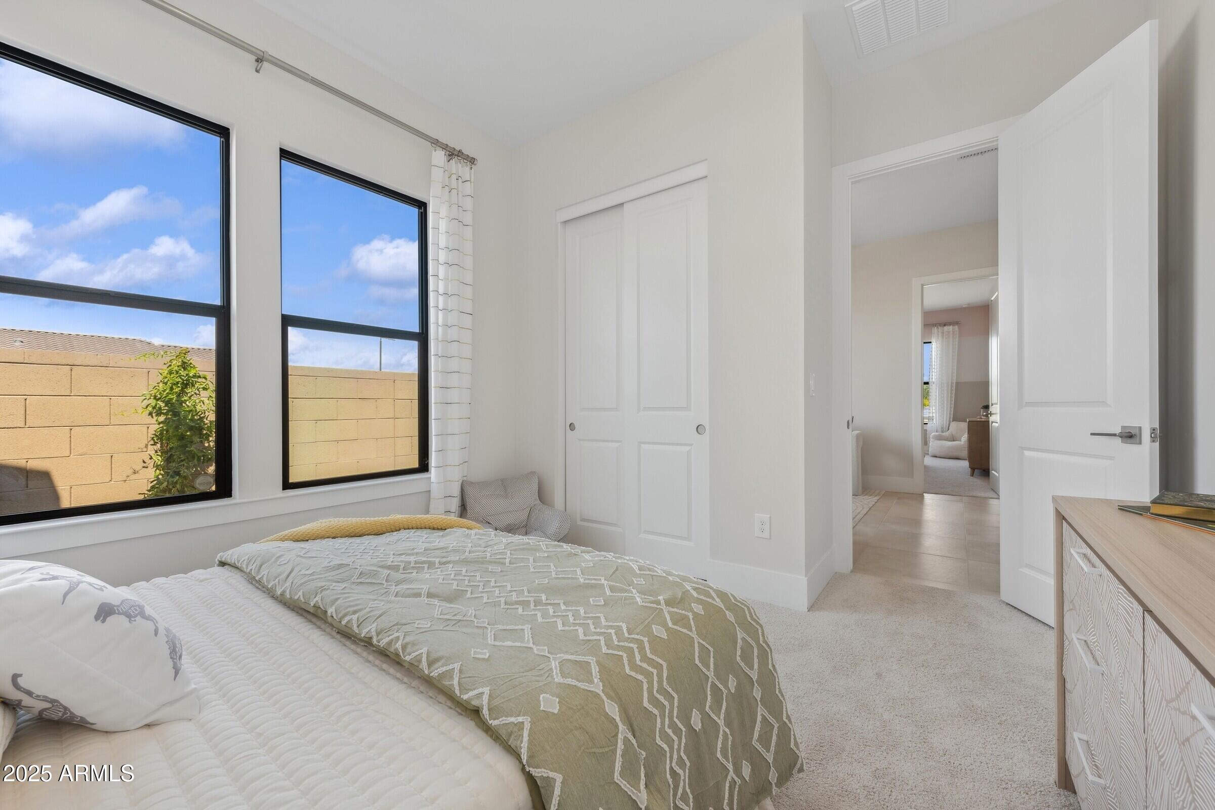 621 East Grayling Road San Tan Valley, AZ 85140 - Photo 16 of 33 a bedroom with a bed and a large window