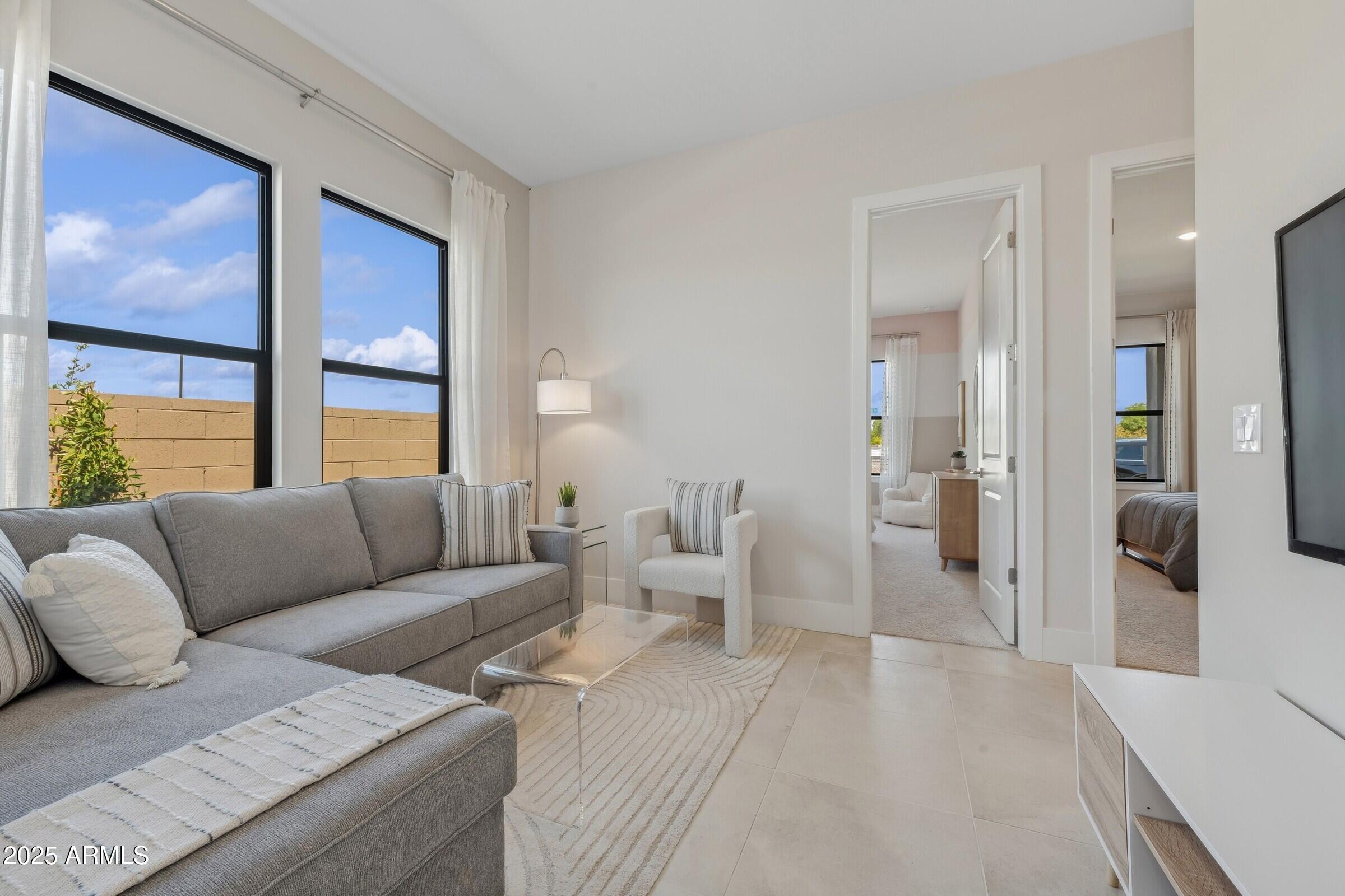 621 East Grayling Road San Tan Valley, AZ 85140 - Photo 17 of 33 a living room with furniture and large windows
