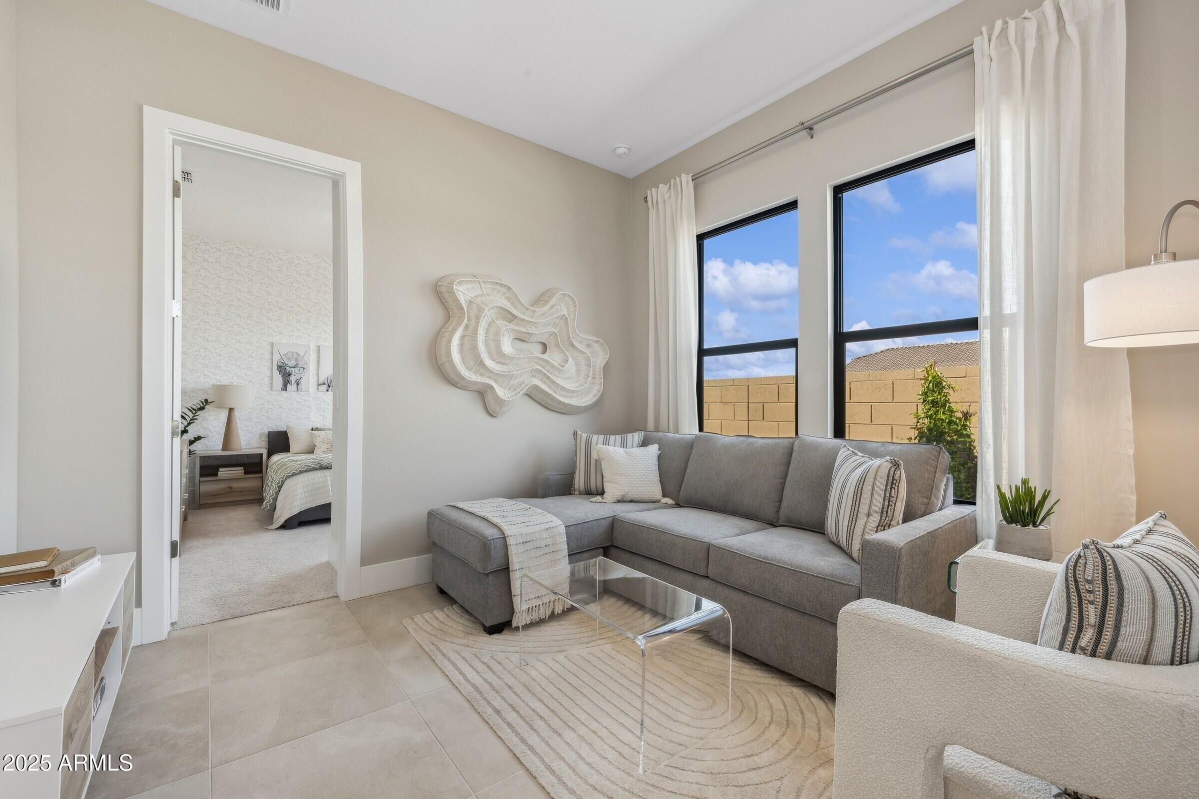 621 East Grayling Road San Tan Valley, AZ 85140 - Photo 18 of 33 a living room with furniture and a large window