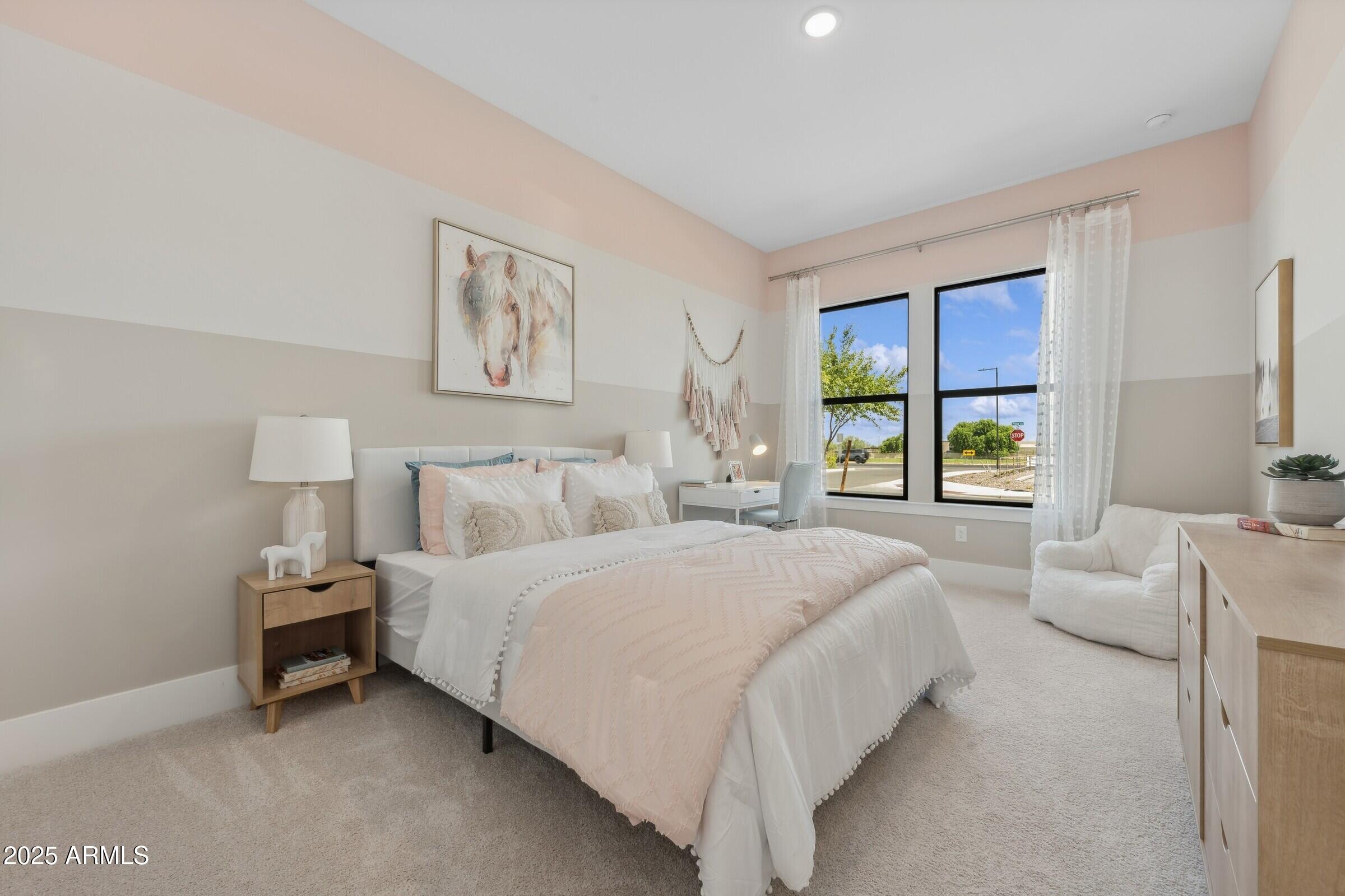 621 East Grayling Road San Tan Valley, AZ 85140 - Photo 20 of 33 a bedroom with a bed and a couch