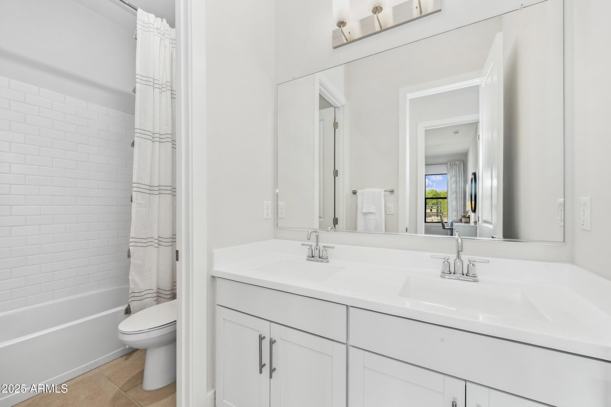 621 East Grayling Road San Tan Valley, AZ 85140 - Photo 24 of 33 a bathroom with a sink a toilet and shower