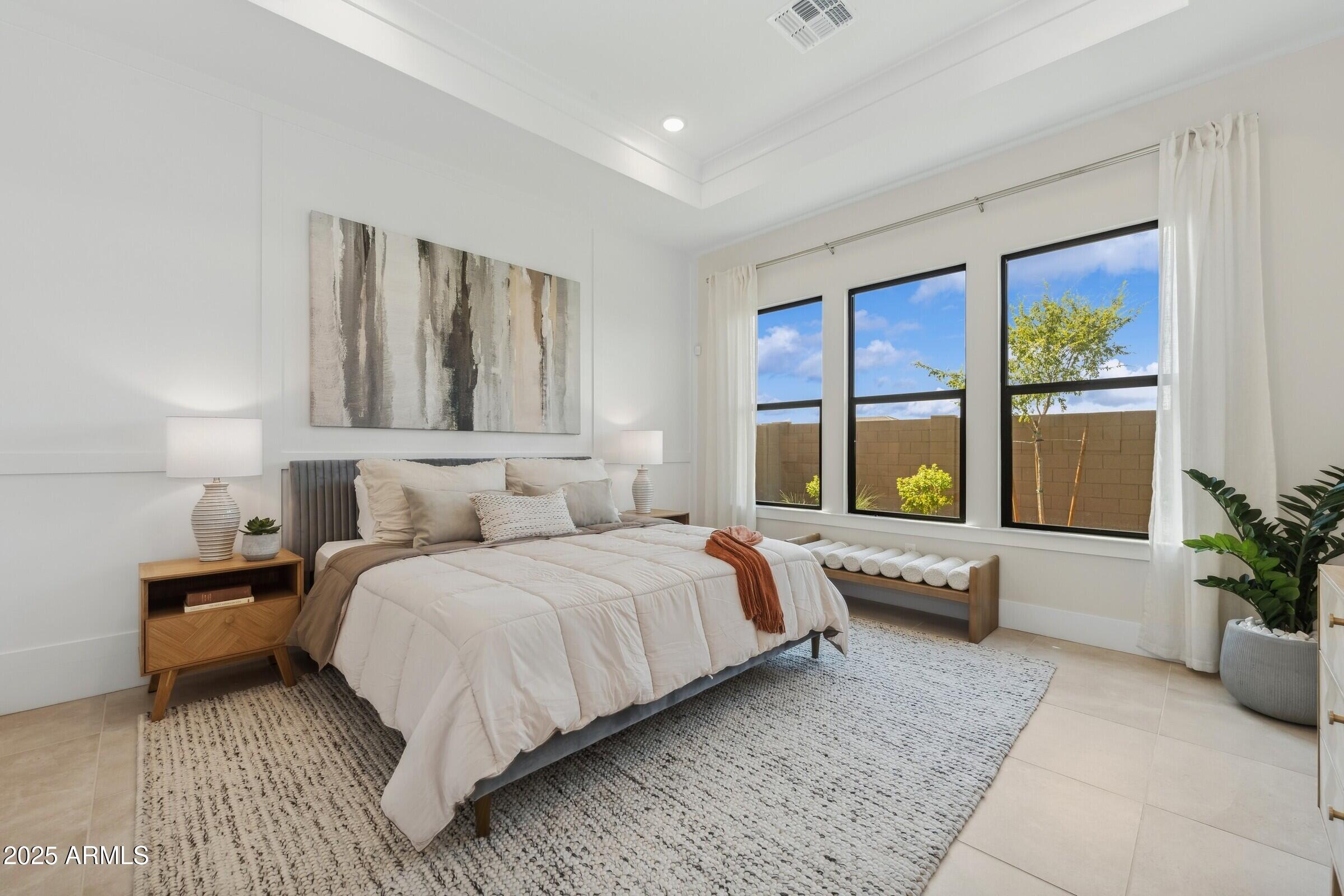 621 East Grayling Road San Tan Valley, AZ 85140 - Photo 26 of 33 a bedroom with a bed and glass window