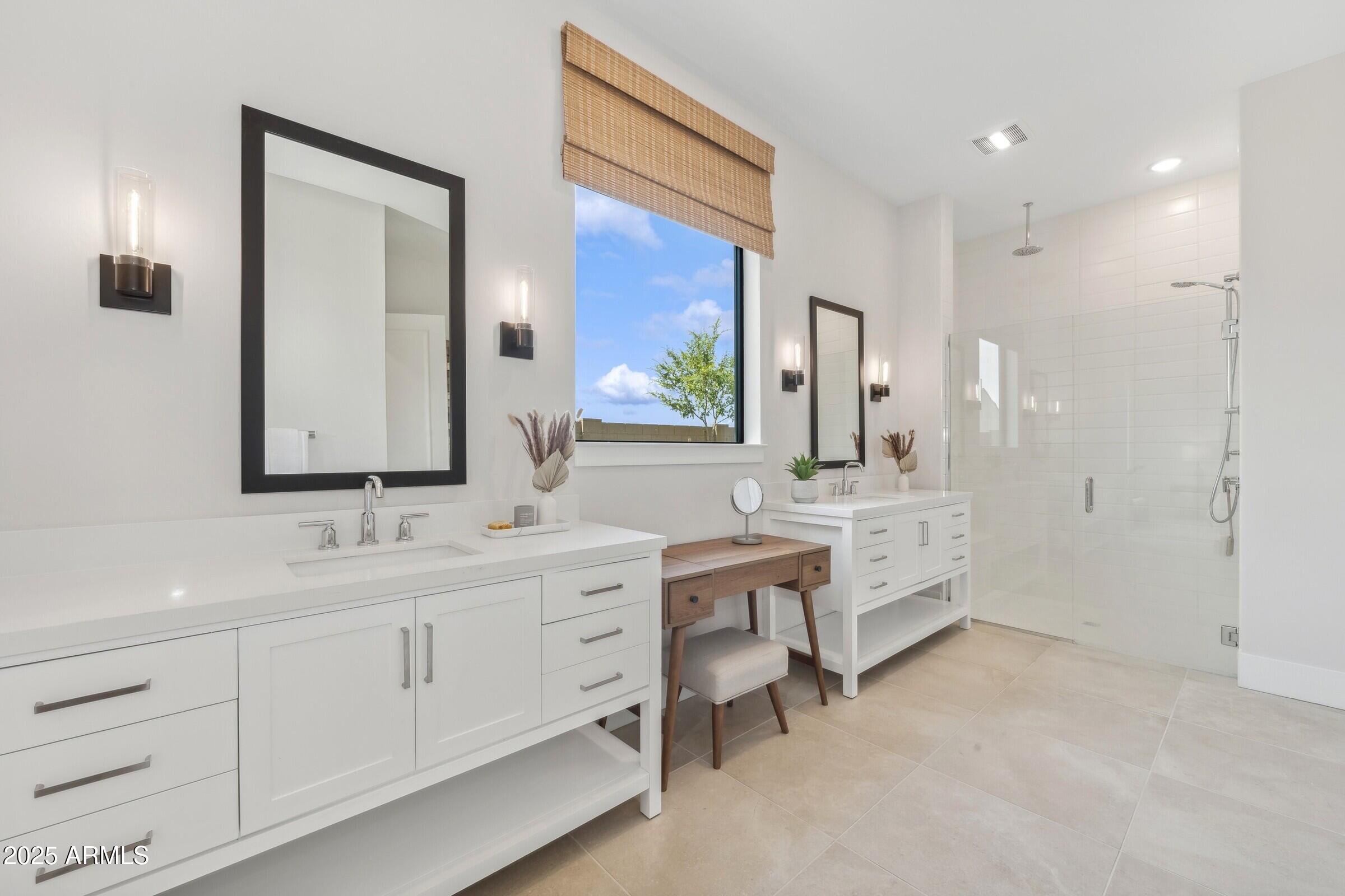 621 East Grayling Road San Tan Valley, AZ 85140 - Photo 28 of 33 a bathroom with double vanity sinks double vanity tub and a mirror