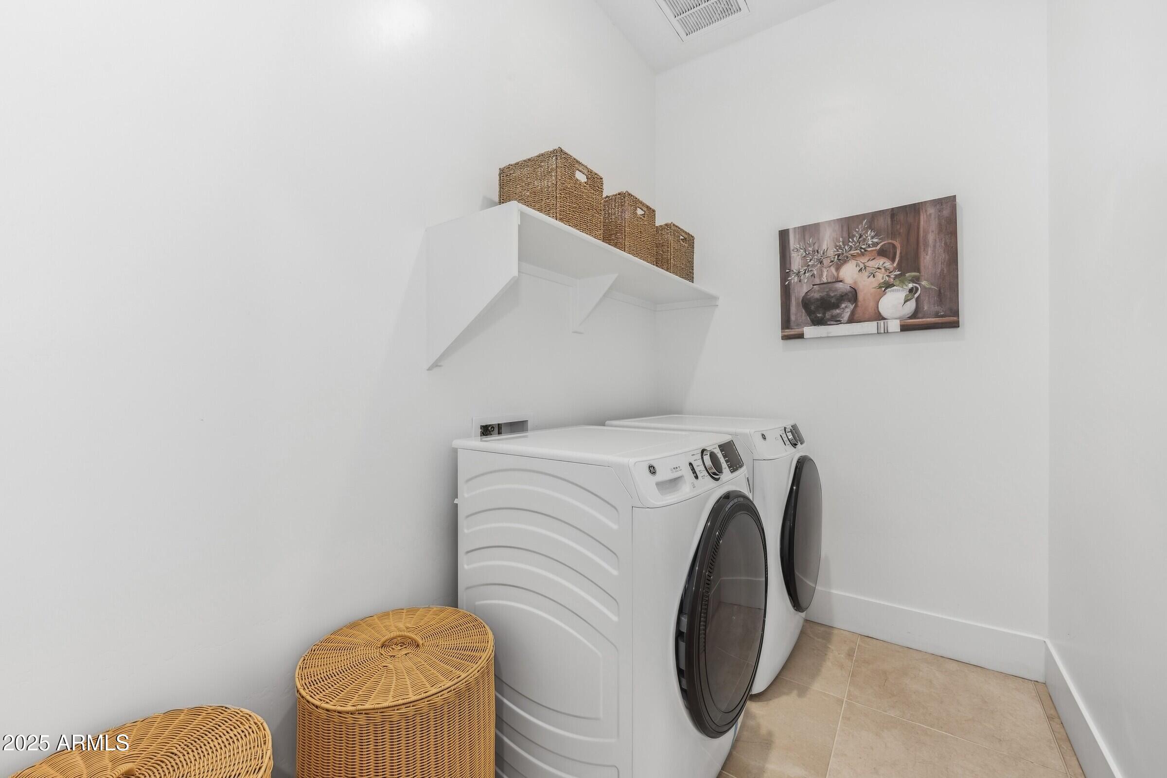 621 East Grayling Road San Tan Valley, AZ 85140 - Photo 32 of 33 a utility room with dryer and washer