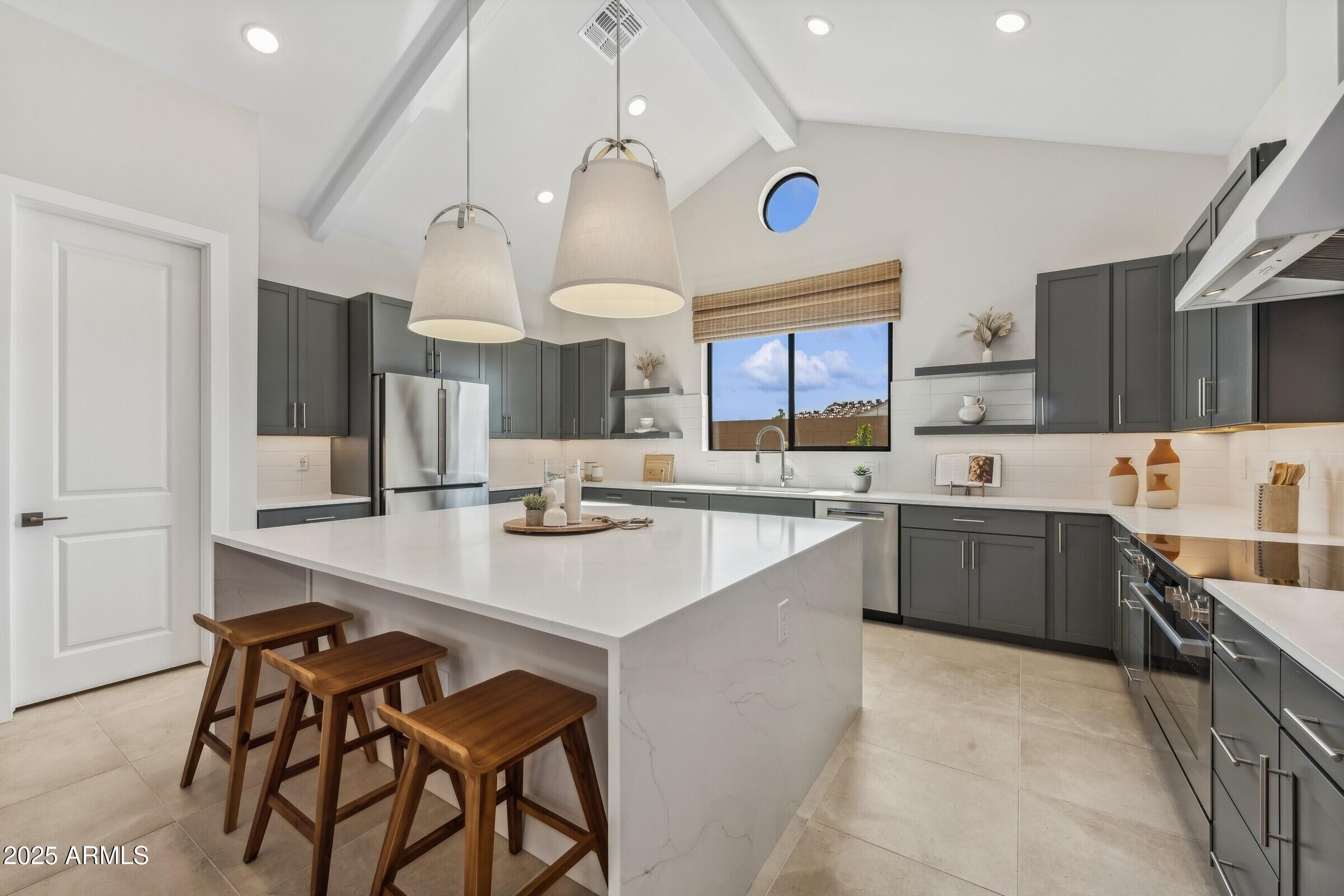 621 East Grayling Road San Tan Valley, AZ 85140 - Photo 4 of 33 a large kitchen with a sink and cabinets