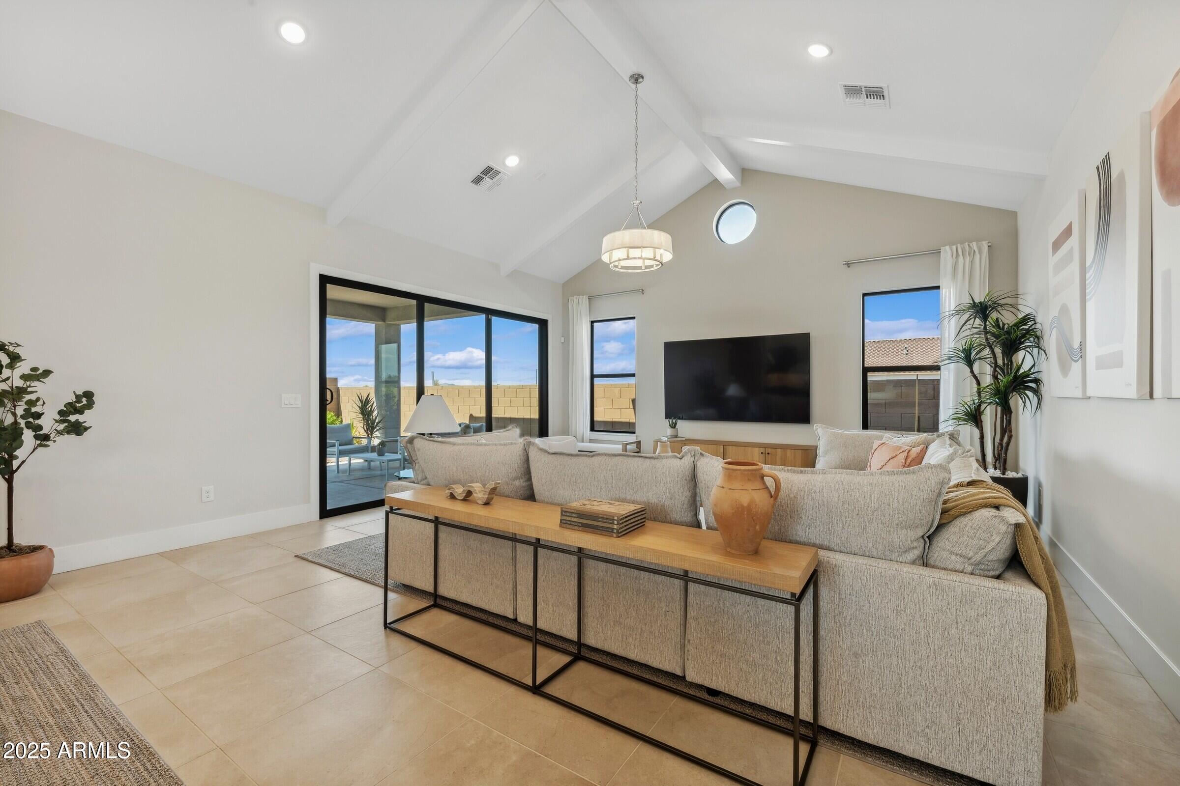 621 East Grayling Road San Tan Valley, AZ 85140 - Photo 8 of 33 a living room with furniture and a flat screen tv