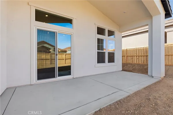a view of an empty room with a fireplace