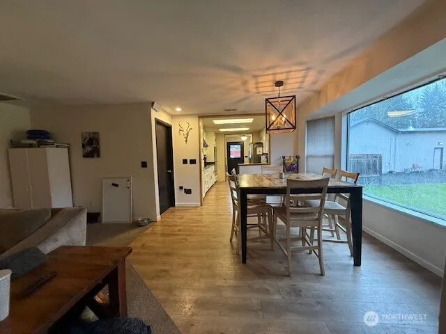 a dining room with a table and chairs