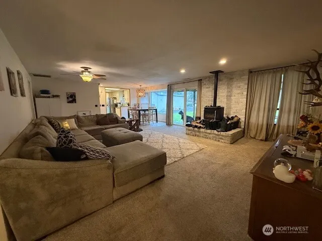 a living room with furniture window and a couch