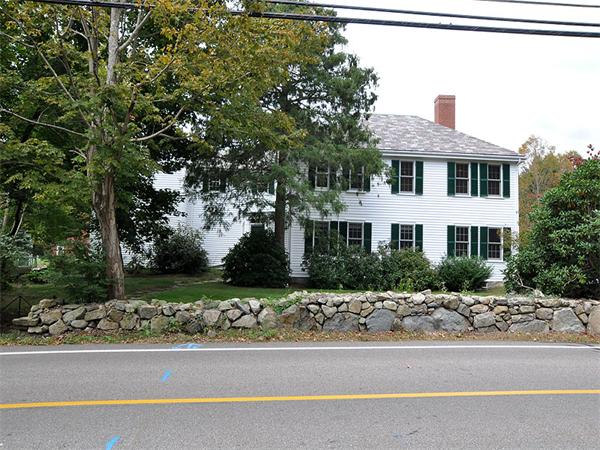 435 High Street Walpole, MA 02081 - Photo 1 of 24 a front view of a house with a yard and garage