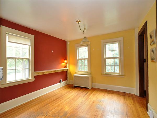 435 High Street Walpole, MA 02081 - Photo 3 of 24 a view of an empty room with wooden floor and a window