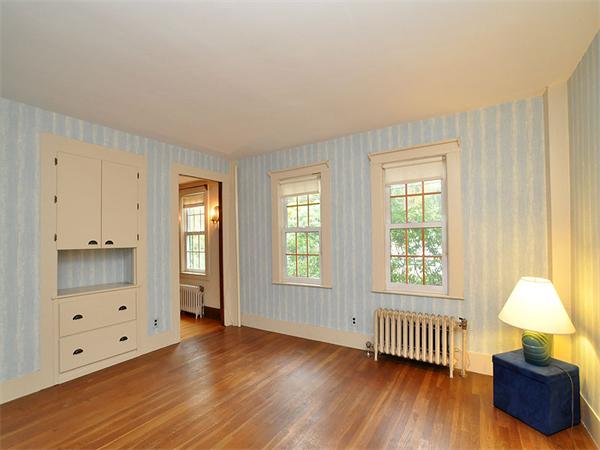 435 High Street Walpole, MA 02081 - Photo 6 of 24 an empty room with windows and wooden floor