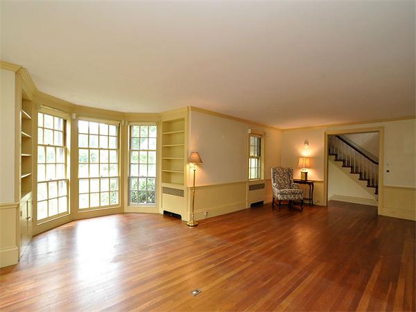 435 High Street Walpole, MA 02081 - Photo 8 of 24 a view of an empty room with a window and wooden floor