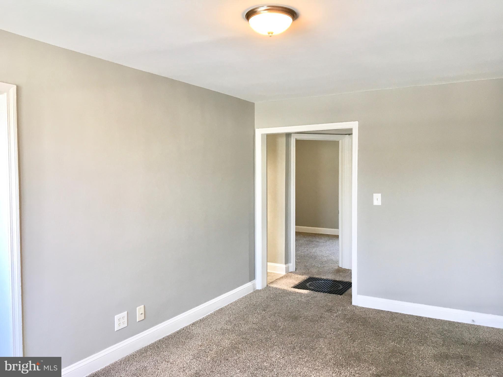 7235 Holabird Avenue, Unit B Dundalk, MD 21222 - Photo 13 of 15 an empty room with window