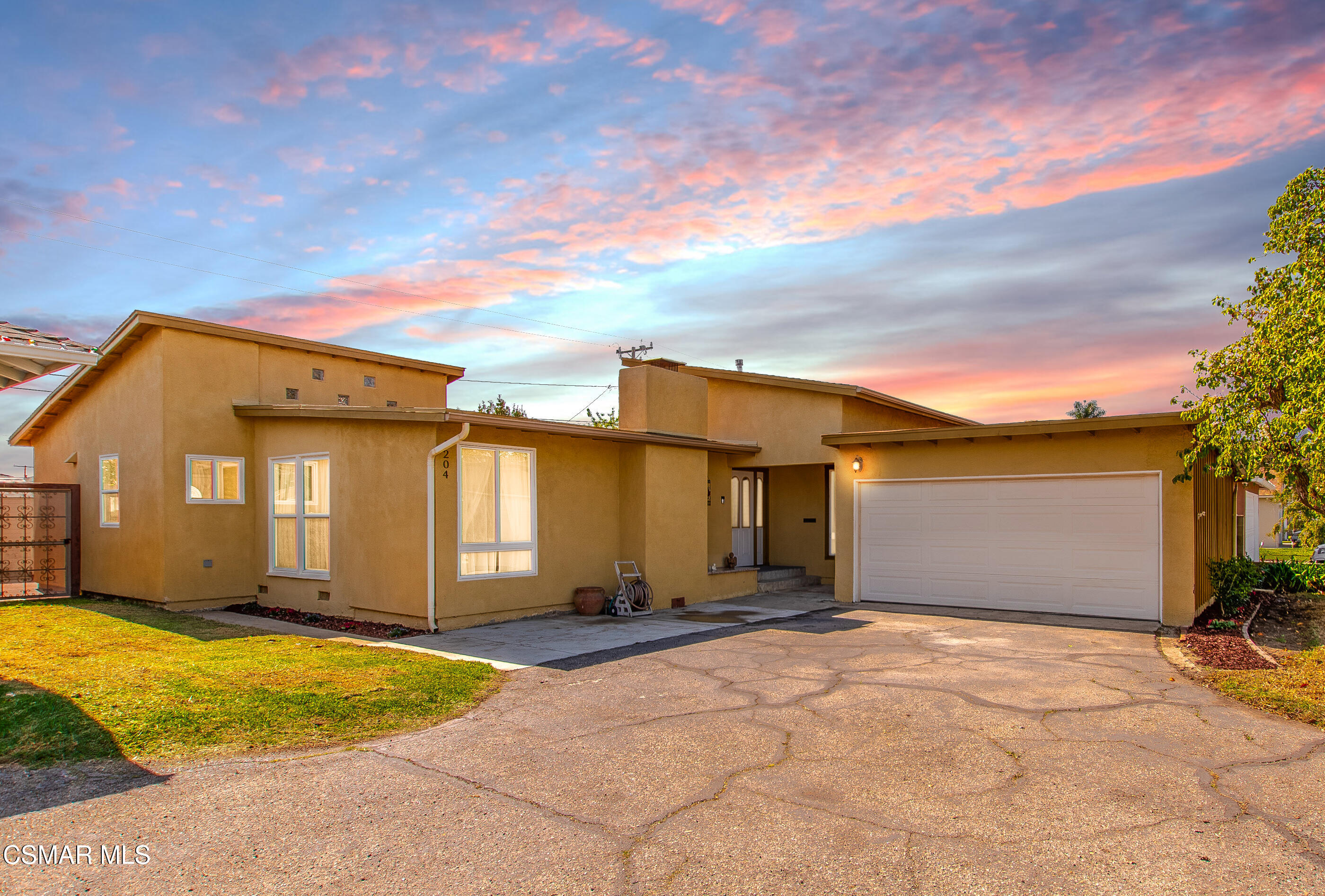 1204 Deodar Avenue Oxnard, CA 93030 - Photo 1 of 25 a front view of a house with a yard