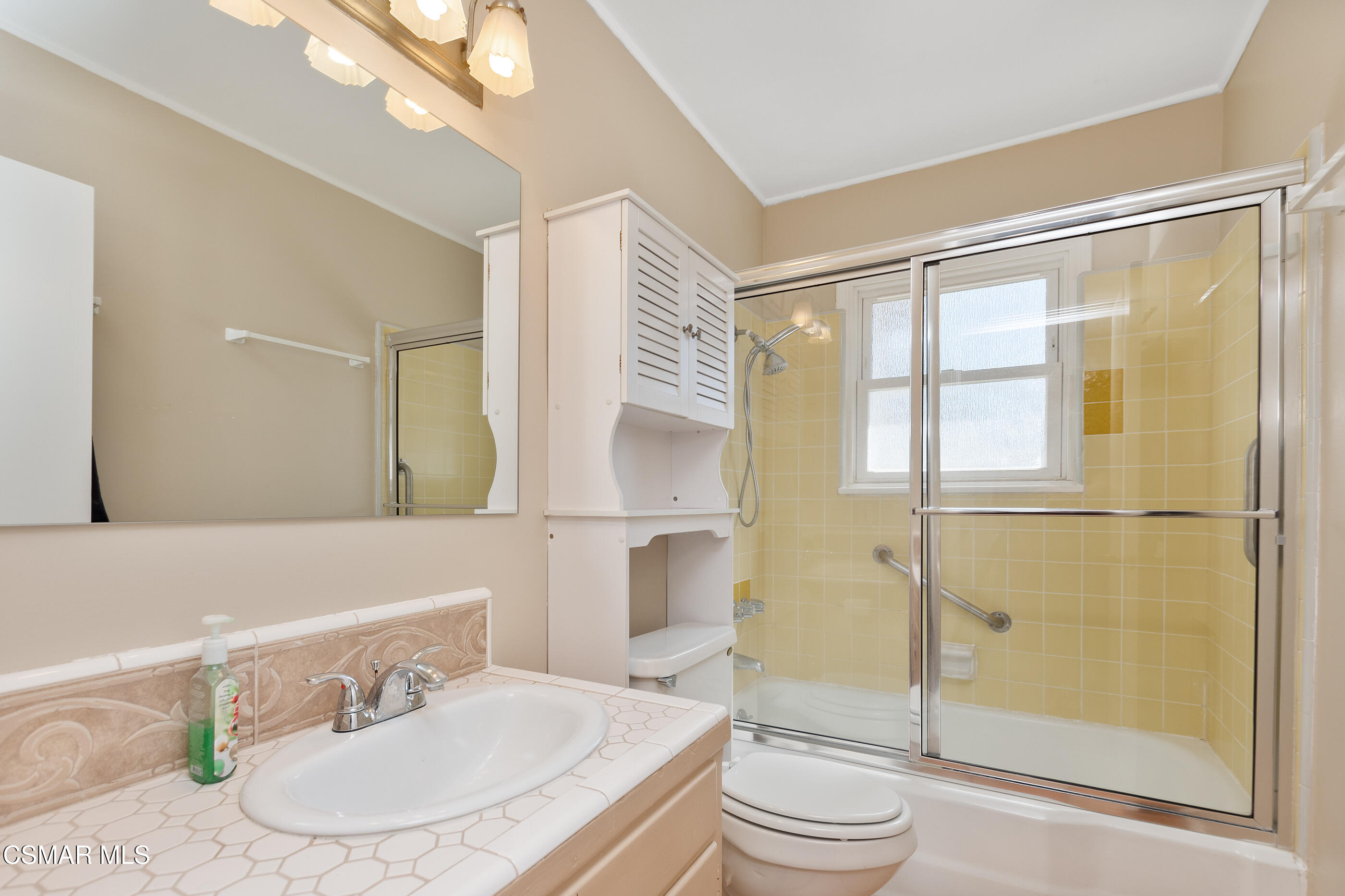 1204 Deodar Avenue Oxnard, CA 93030 - Photo 11 of 25 a bathroom with a sink toilet and shower