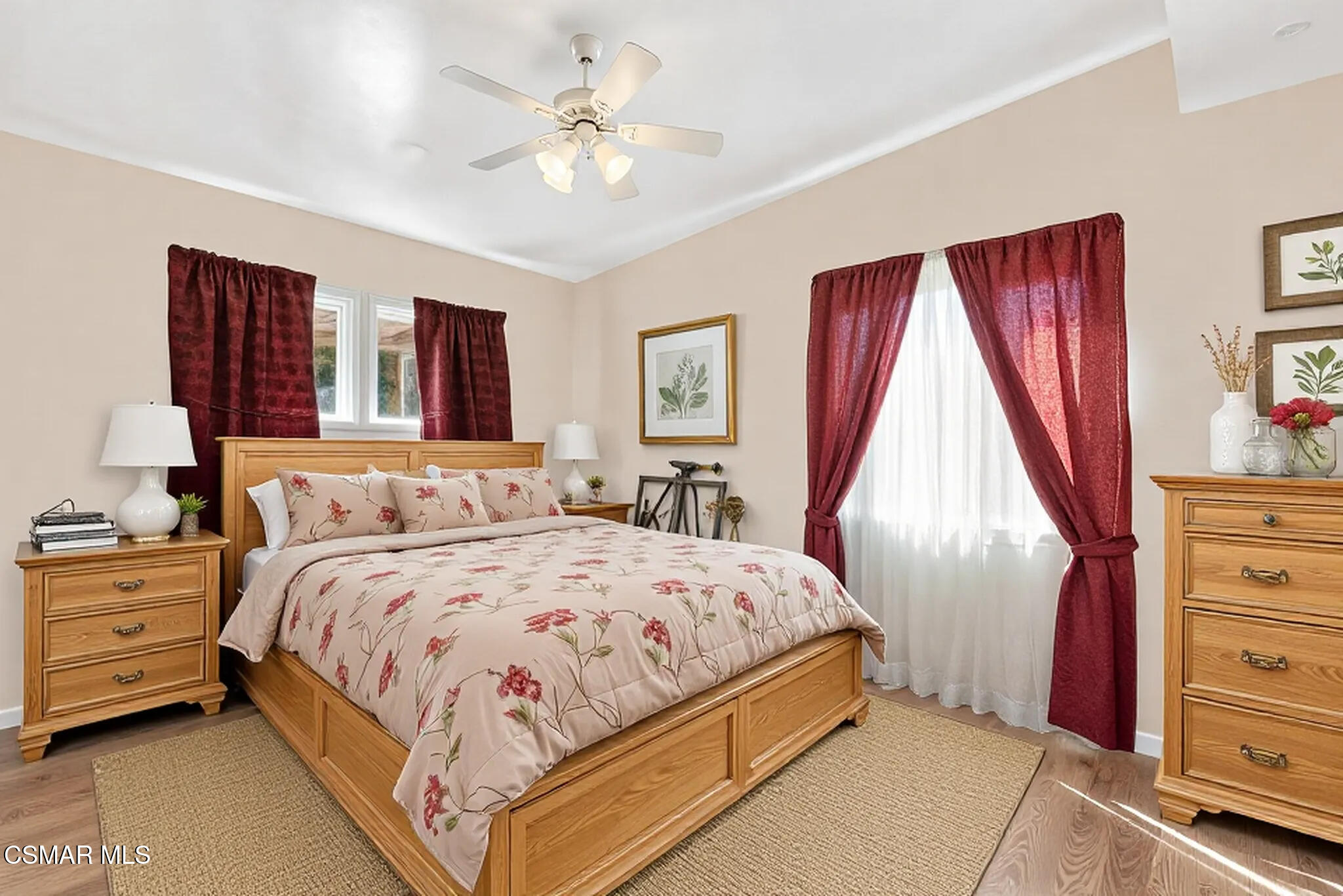 1204 Deodar Avenue Oxnard, CA 93030 - Photo 14 of 25 a bedroom with a large bed and a chandelier