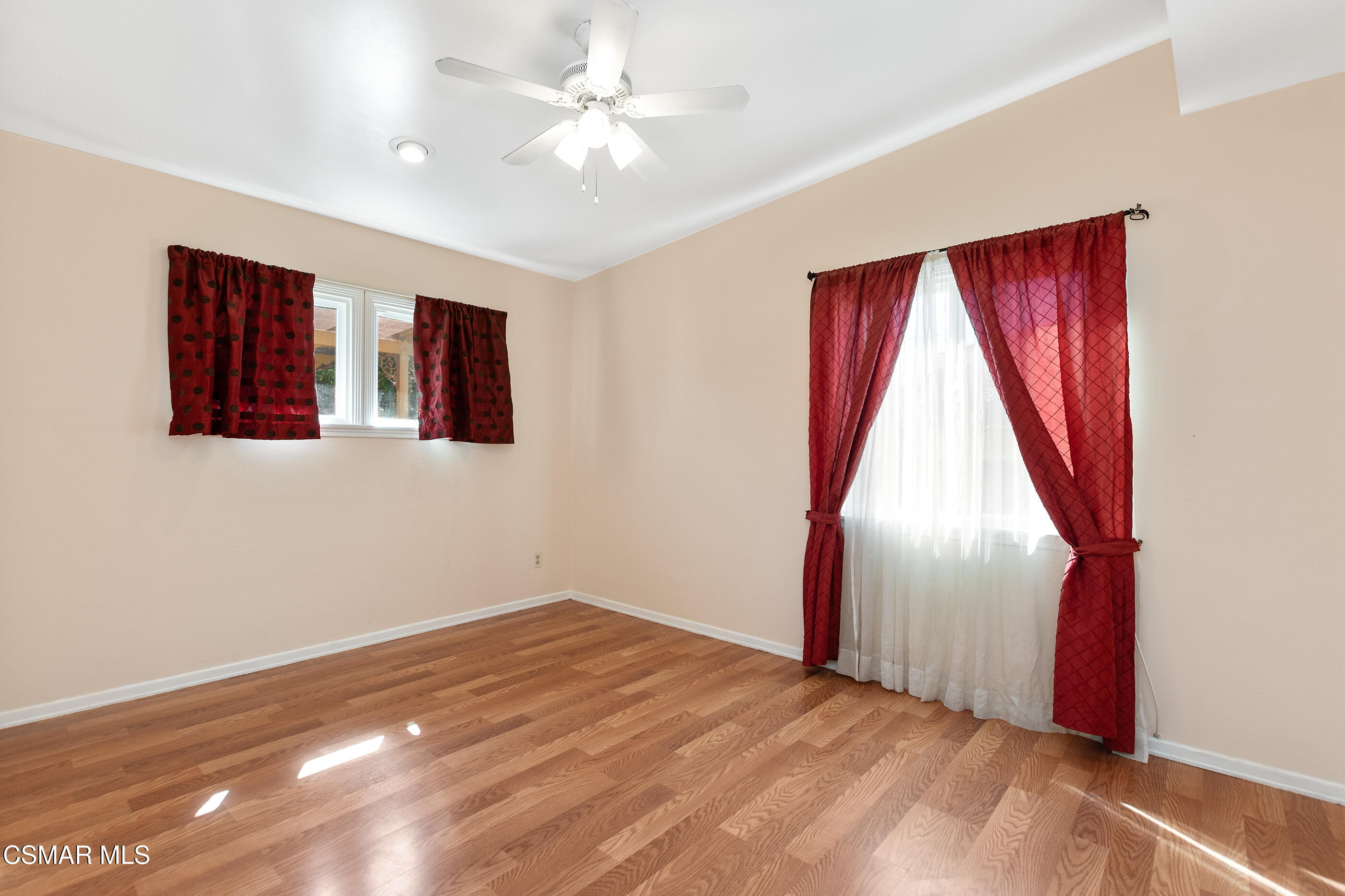 1204 Deodar Avenue Oxnard, CA 93030 - Photo 15 of 25 a view of a bedroom with window and ceiling fan