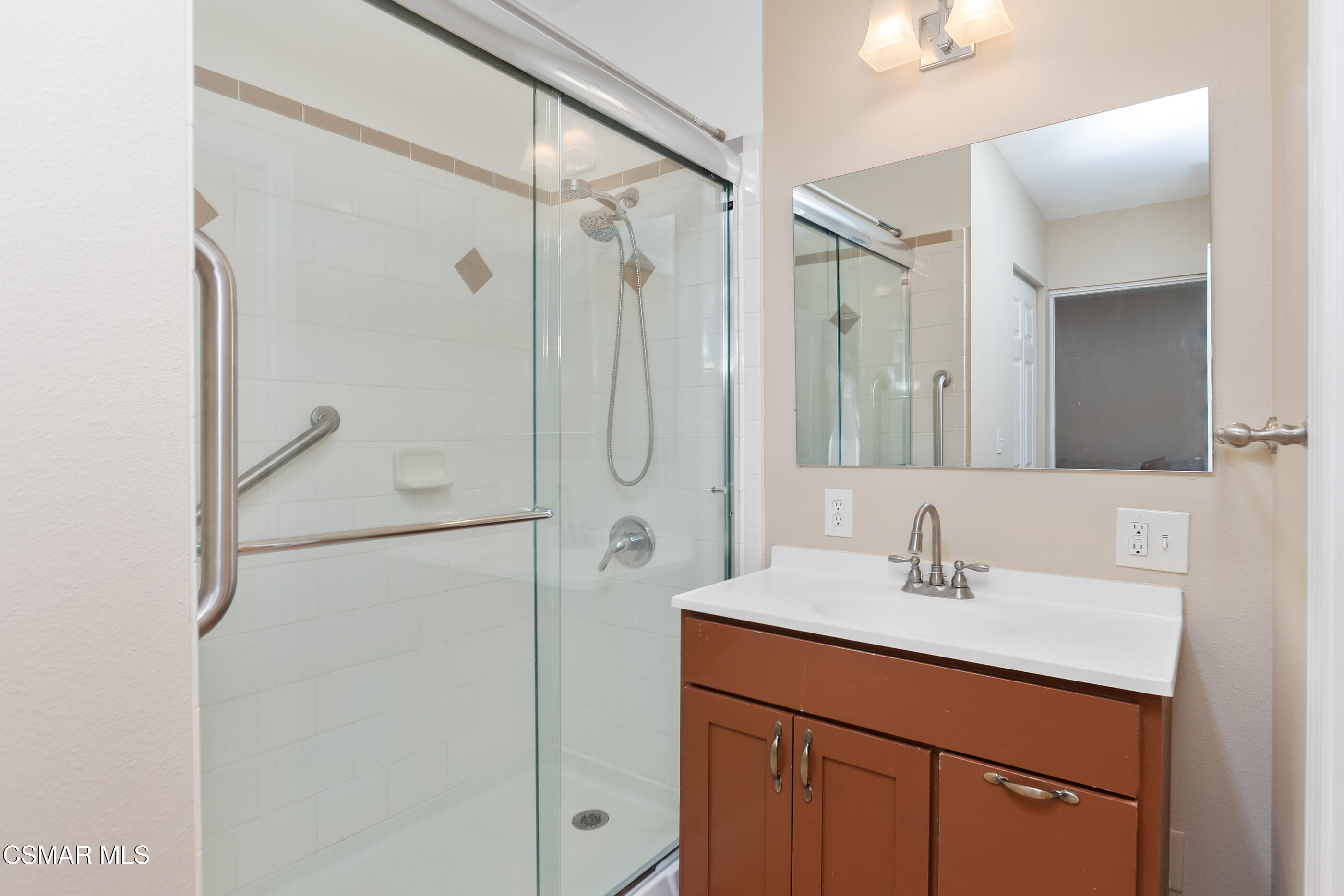 1204 Deodar Avenue Oxnard, CA 93030 - Photo 20 of 25 a bathroom with a shower sink and mirror