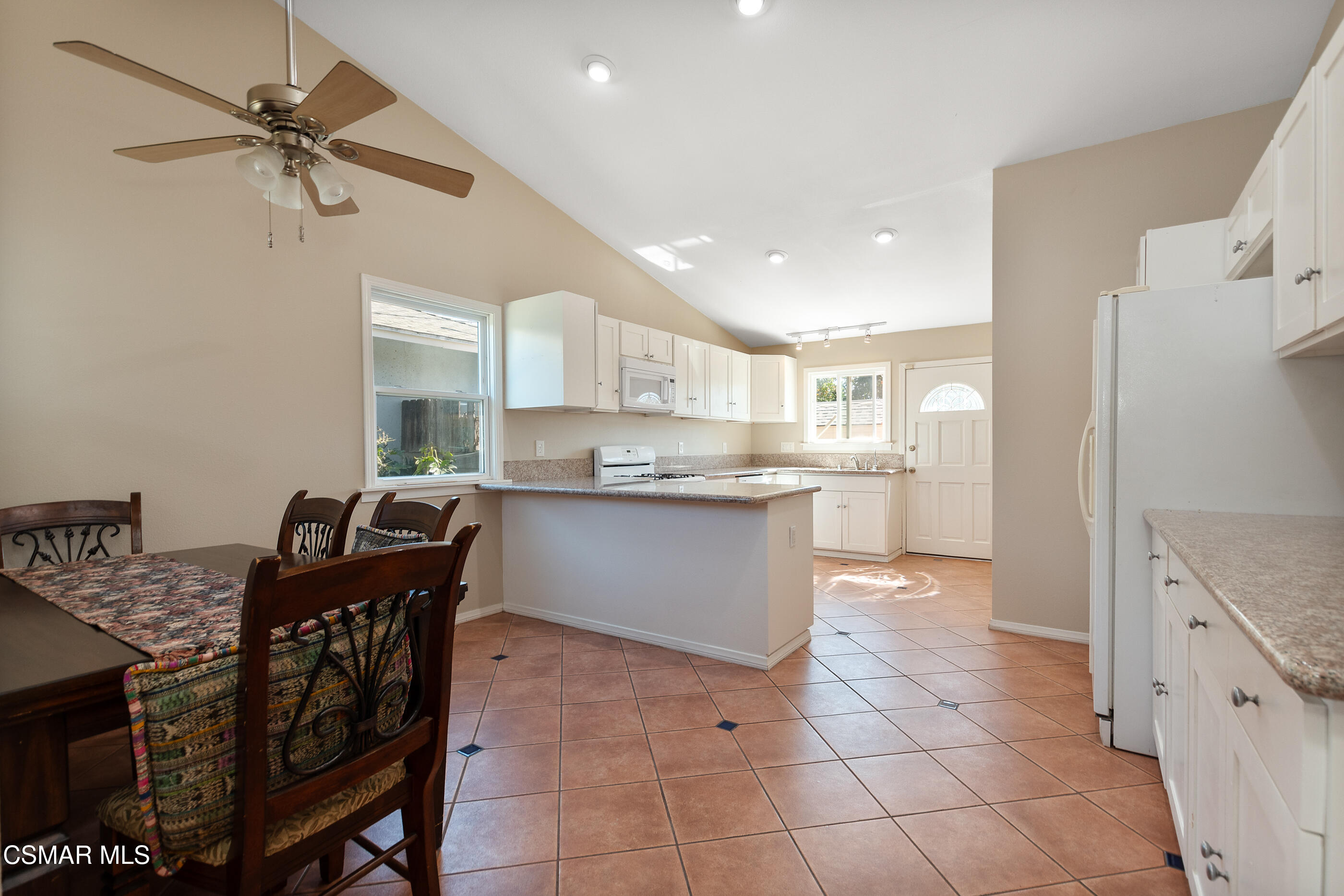 1204 Deodar Avenue Oxnard, CA 93030 - Photo 7 of 25 a kitchen with stainless steel appliances granite countertop a stove a sink and a refrigerator