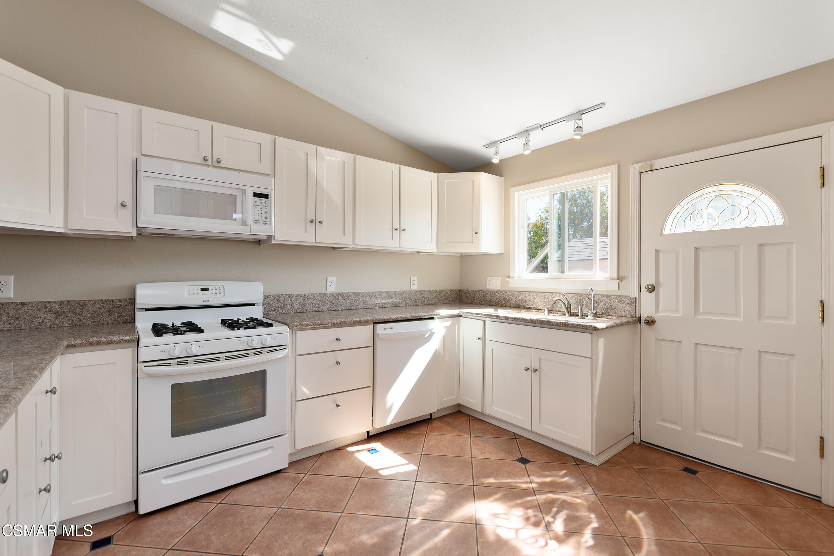 1204 Deodar Avenue Oxnard, CA 93030 - Photo 8 of 25 a kitchen with granite countertop white cabinets white stainless steel appliances and sink