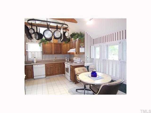 1807 Falls Church Road Raleigh, NC 27609 - Photo 5 of 12 a kitchen with a sink cabinets and window