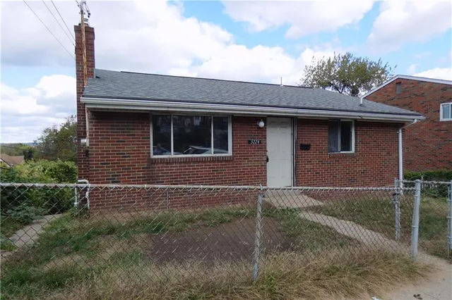 a front view of a house with garage