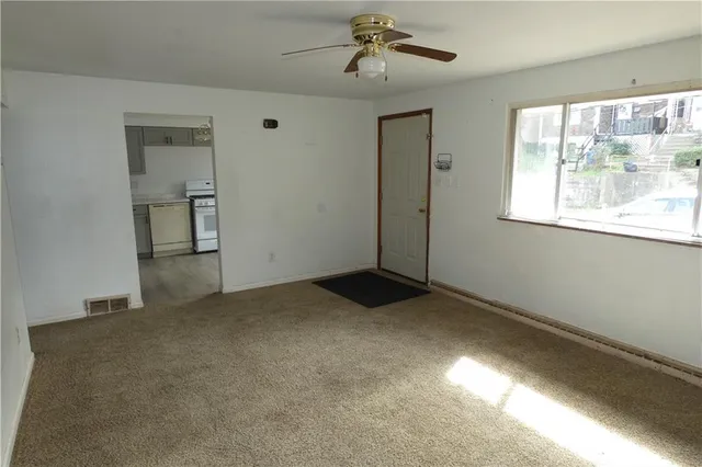 a view of empty room with windows