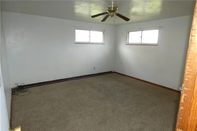 en empty room with windows