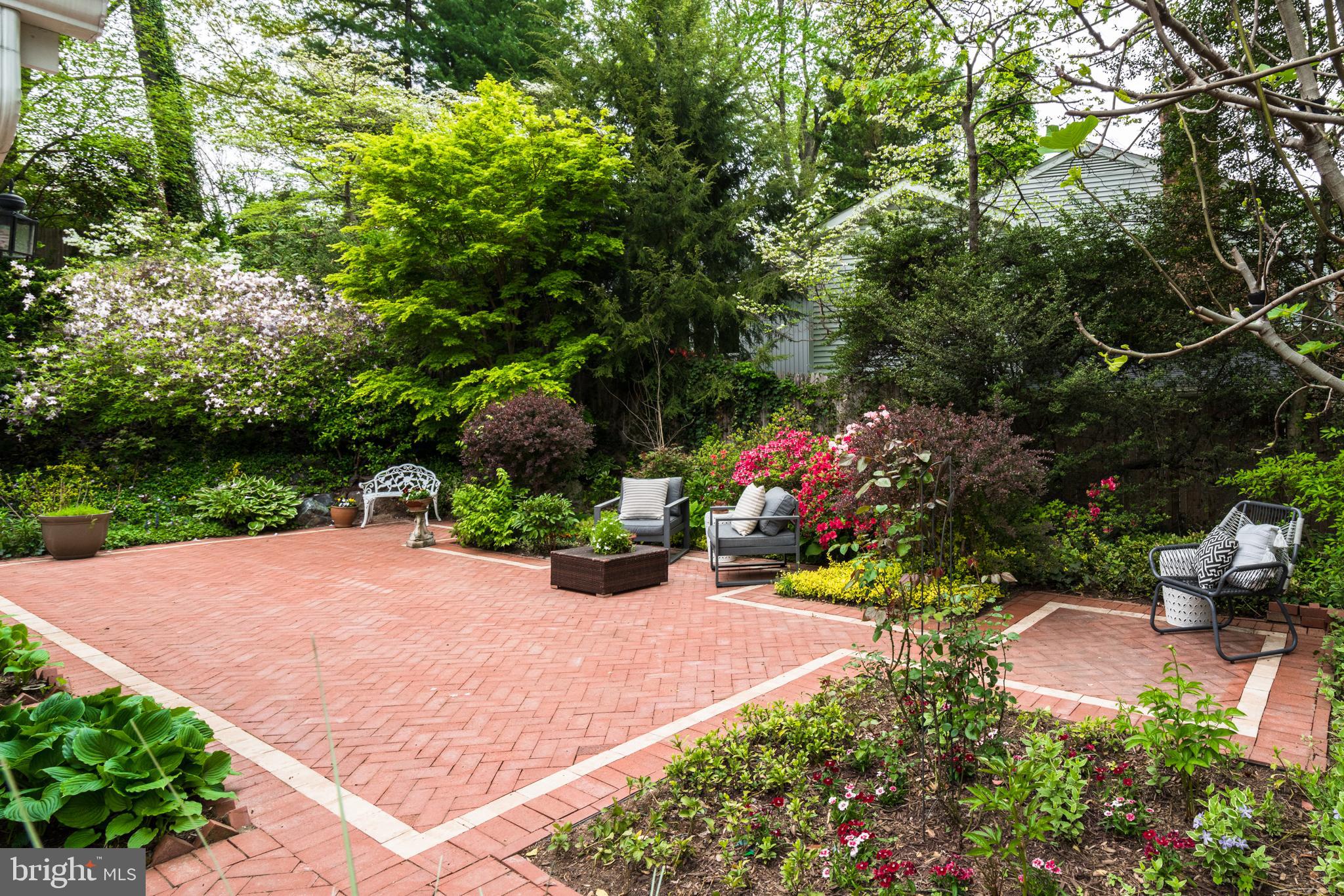 6202 Redwing Road Bethesda, MD 20817 - Photo 32 of 37 a view of a backyard with plants and patio
