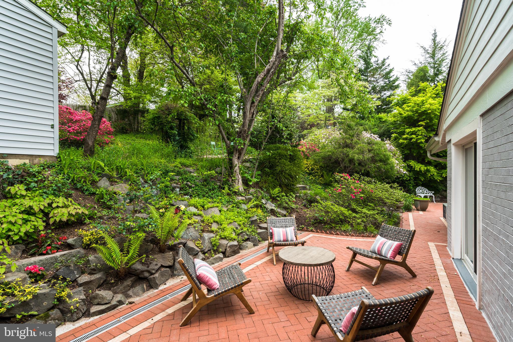 6202 Redwing Road Bethesda, MD 20817 - Photo 4 of 8 Serene garden retreat with inviting seating.