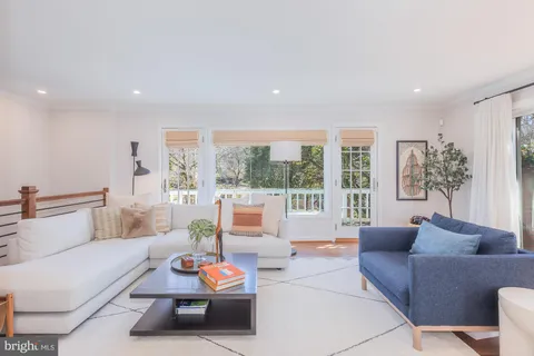 a view of a backyard with sitting area