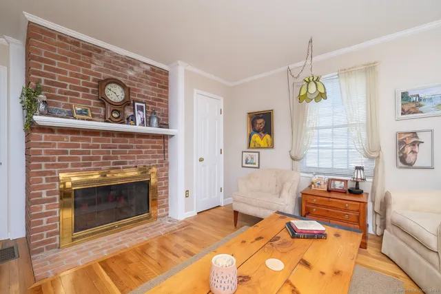 a bedroom with a bed and a fireplace