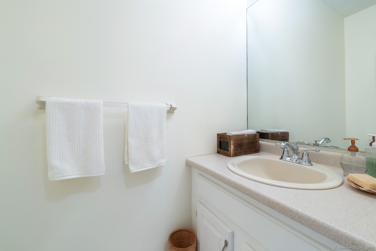 19 Prospect Ridge, Unit 14 Ridgefield, CT 06877 - Photo 13 of 36 a bathroom with a sink and a mirror