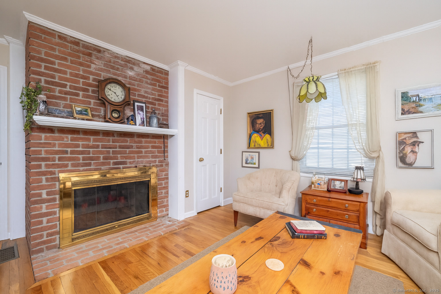 19 Prospect Ridge, Unit 14 Ridgefield, CT 06877 - Photo 20 of 36 a bedroom with a bed and a fireplace