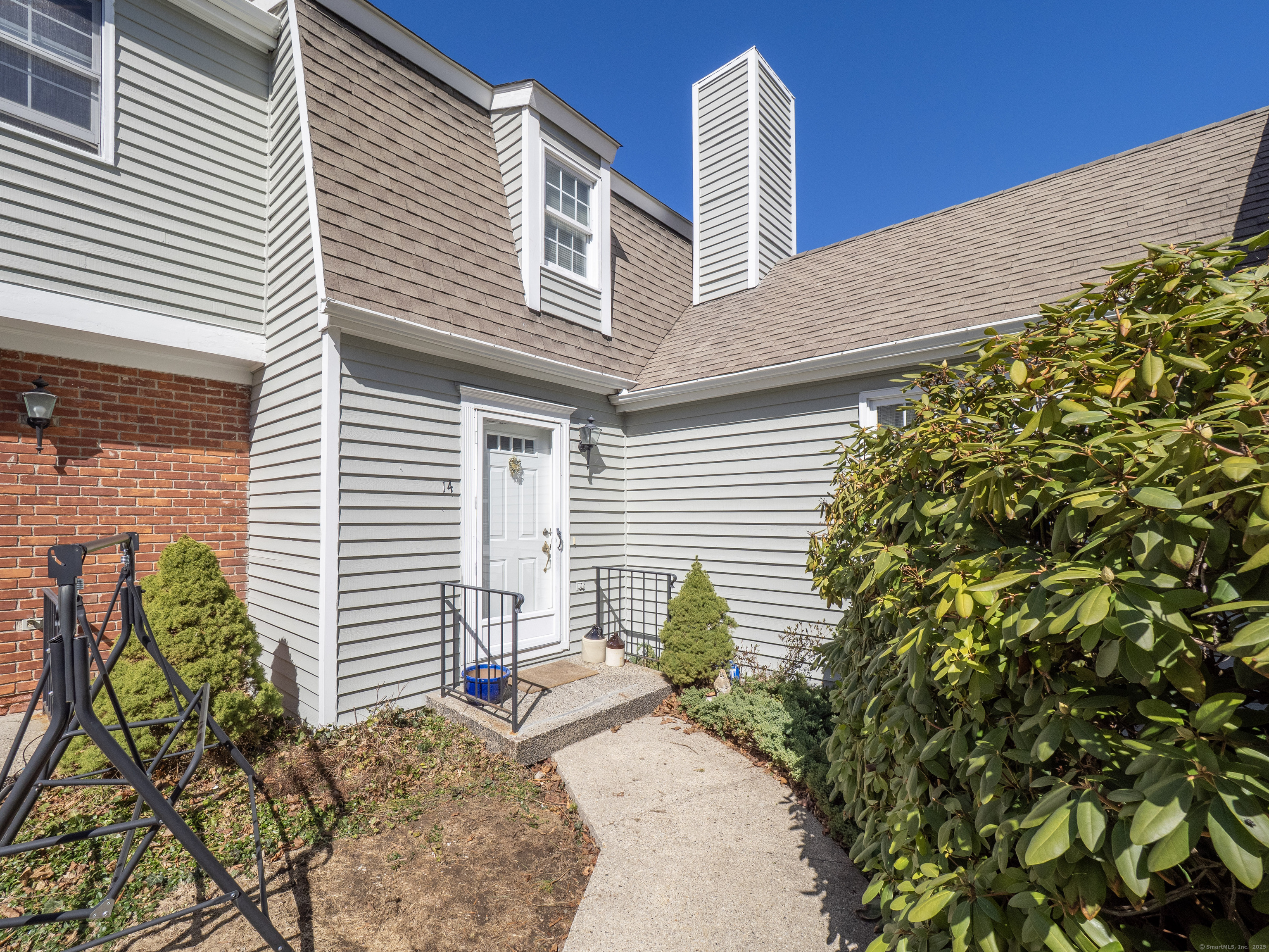 19 Prospect Ridge, Unit 14 Ridgefield, CT 06877 - Photo 2 of 36 a view of a house with a backyard