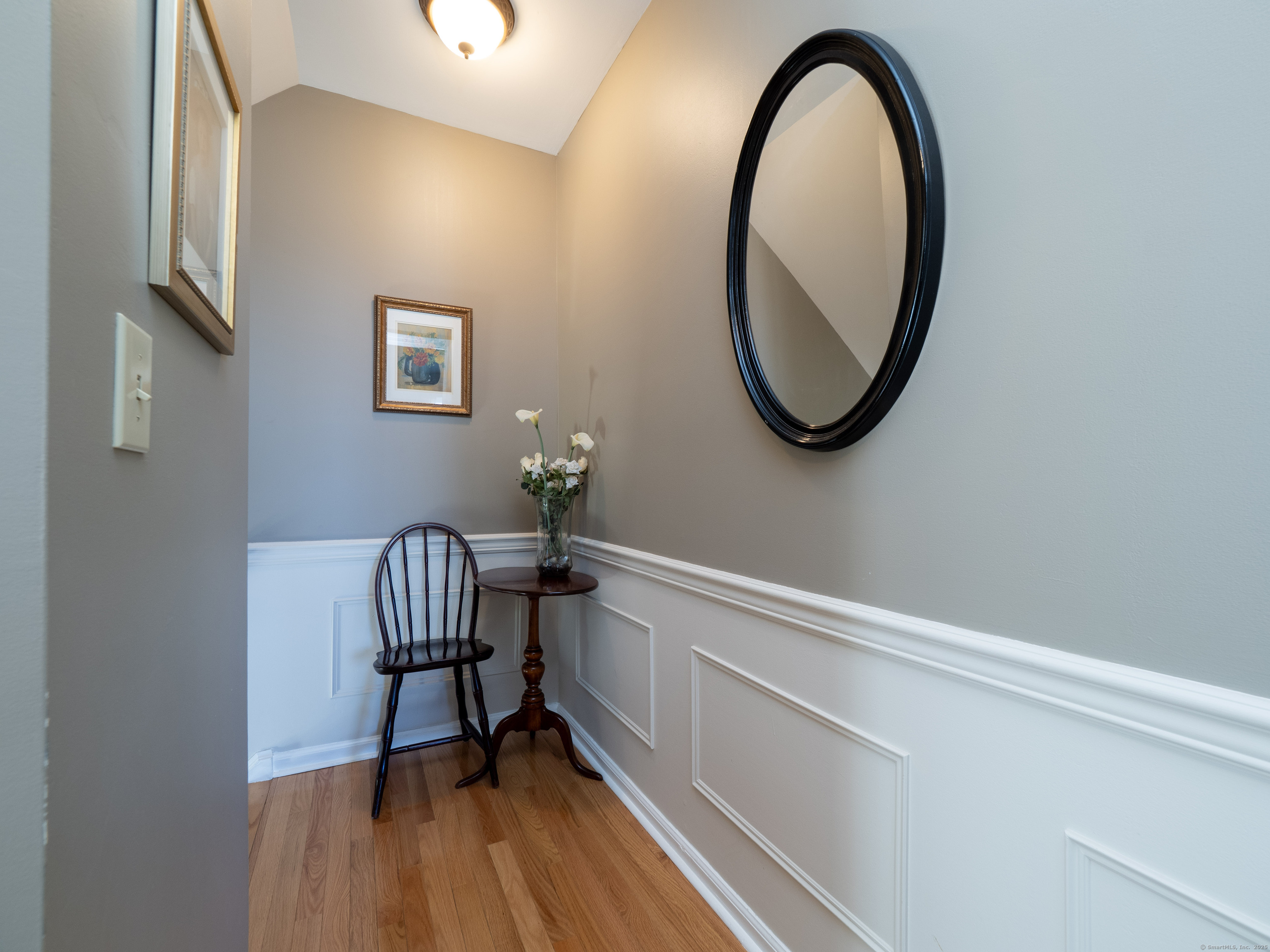 19 Prospect Ridge, Unit 14 Ridgefield, CT 06877 - Photo 22 of 36 a view of a hallway with wooden floor and glass door