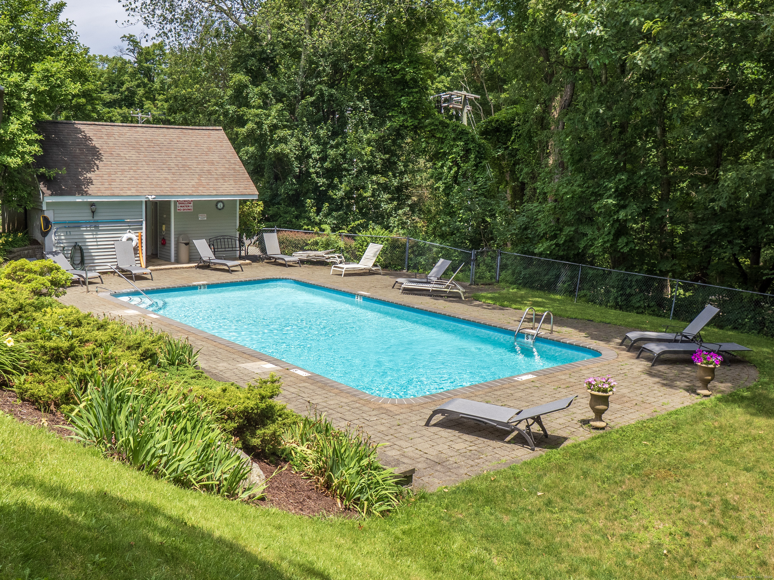 19 Prospect Ridge, Unit 14 Ridgefield, CT 06877 - Photo 24 of 36 a view of a house with pool and a yard