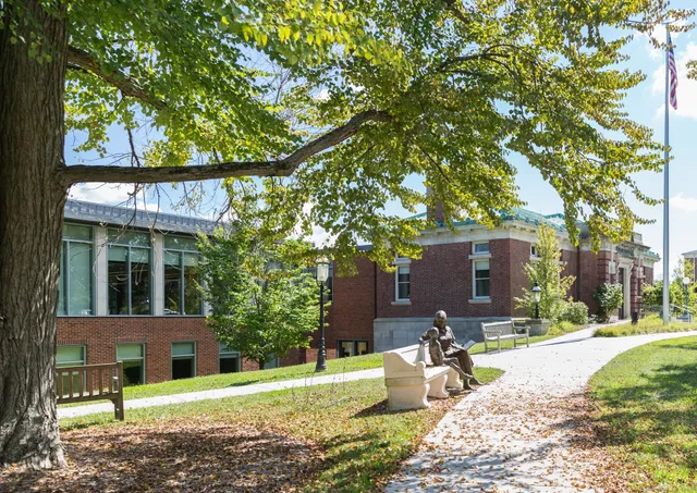 a view of a patio with table and chairs potted plants and wooden floor