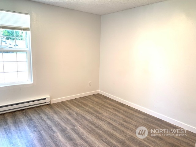 3915 Mason Loop Road Tacoma, WA 98409 - Photo 13 of 38 a view of a room with wooden floor and window