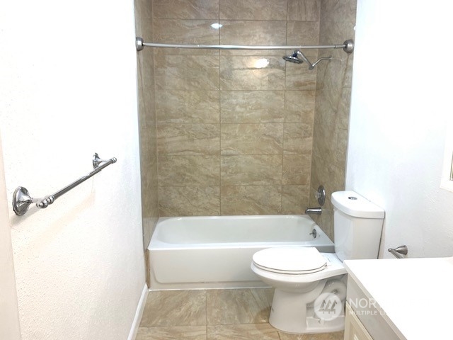 3915 Mason Loop Road Tacoma, WA 98409 - Photo 19 of 38 a bathroom with a toilet and a bathtub