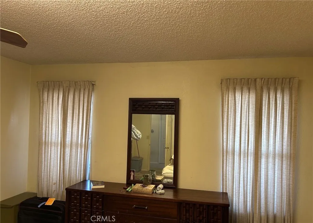27250 Murrieta Road, Unit 347 Menifee, CA 92586 - Photo 17 of 38 a bathroom with a mirror and a sink