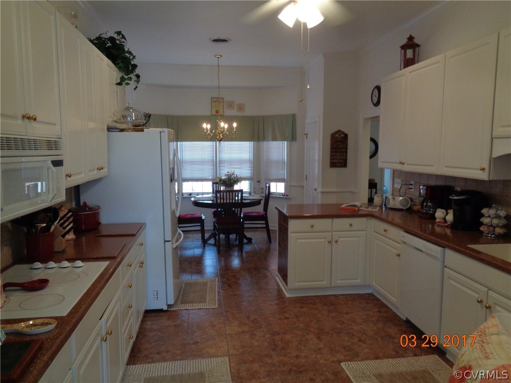 13018 Chipstead Road Chester, VA 23831 - Photo 11 of 47 a kitchen with a sink stove and cabinets