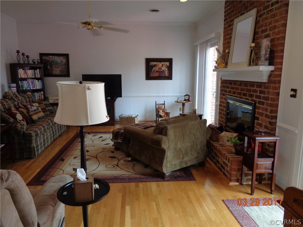 13018 Chipstead Road Chester, VA 23831 - Photo 16 of 47 a living room with furniture and a fireplace