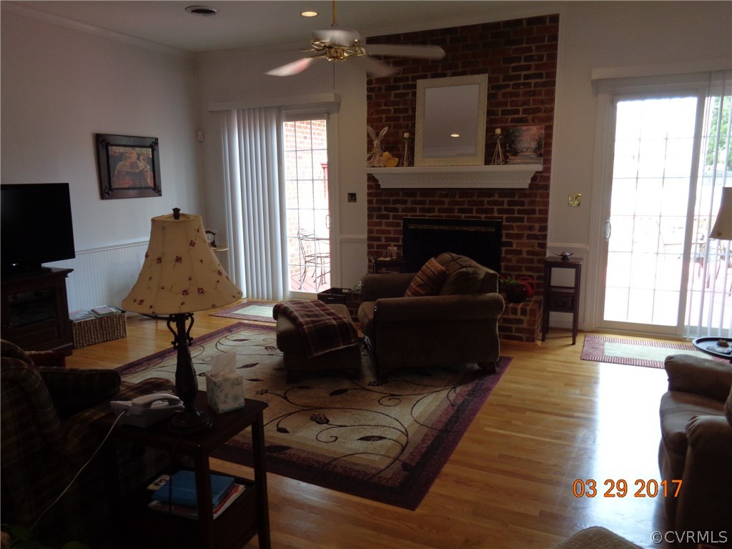 13018 Chipstead Road Chester, VA 23831 - Photo 17 of 47 a living room with furniture and a fireplace