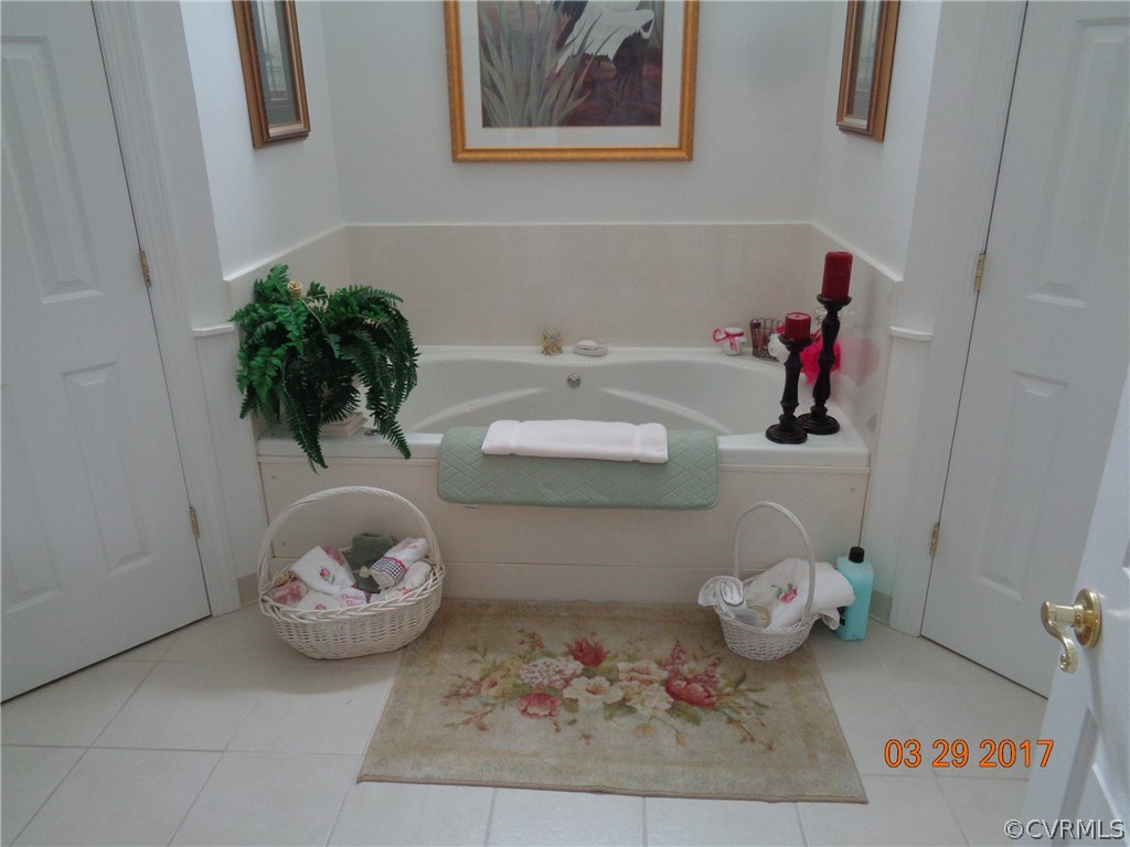 13018 Chipstead Road Chester, VA 23831 - Photo 29 of 47 a bathroom with a sink and a mirror