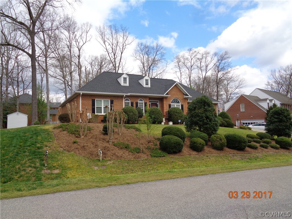 13018 Chipstead Road Chester, VA 23831 - Photo 3 of 47 a front view of a house with a garden