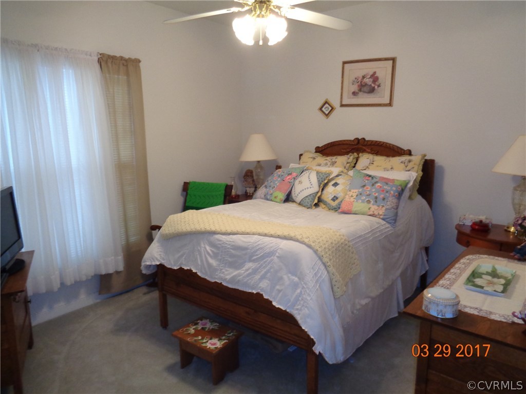 13018 Chipstead Road Chester, VA 23831 - Photo 33 of 47 a bed sitting in a bedroom next to a window