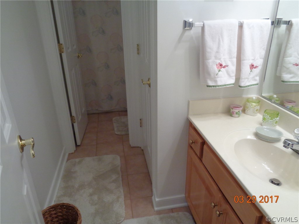 13018 Chipstead Road Chester, VA 23831 - Photo 34 of 47 a bathroom with a sink and a mirror